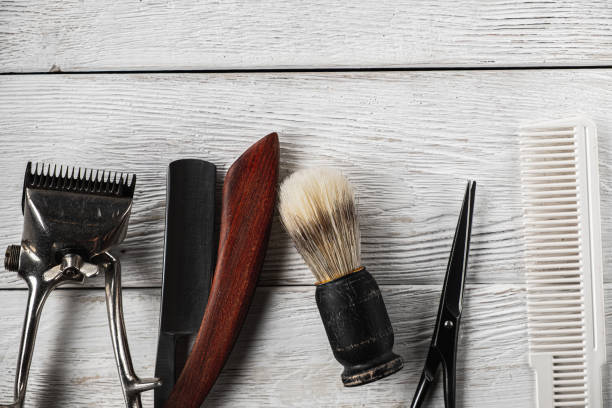 istock vintage barber tools dangerous razor hairdressing scissors old manual clipper comb shaving brush. 1193739471