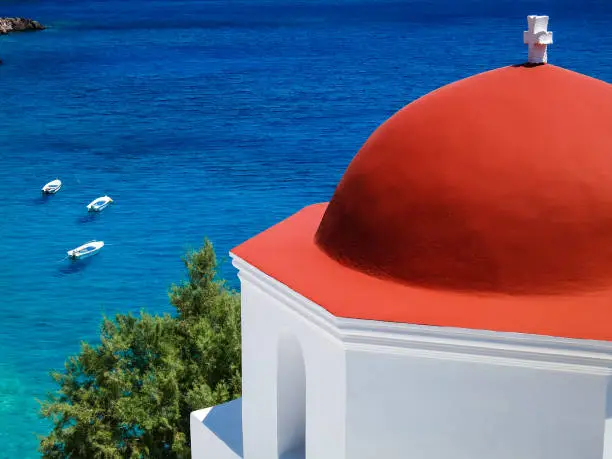 Karpathos, Greece: Aerial View of Blue Sea and Typical Church with Red Roof