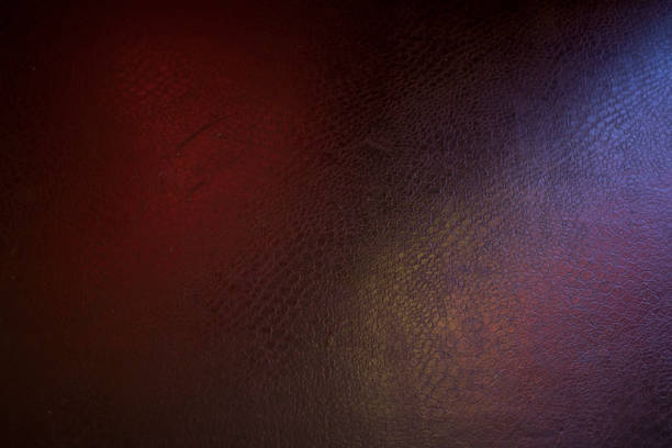 istock black leather background with pink and green highlight 1193740147