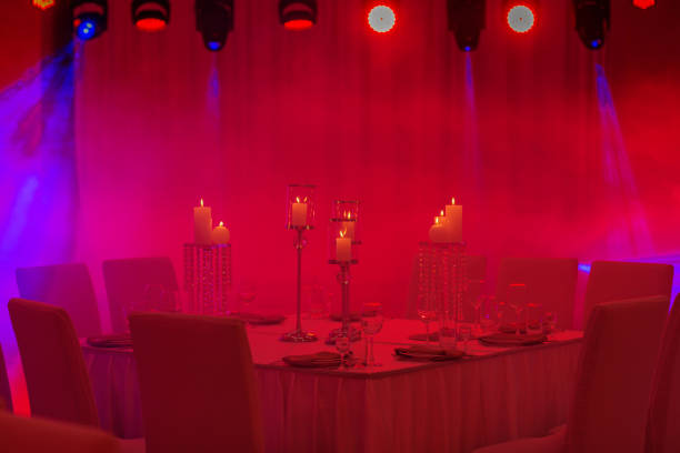 istock Luxurious wedding table with decor, with silver candlesticks, candles and flowers in blue light. Selective photo 1193740826