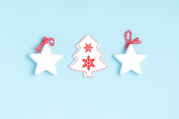 istock New Year and Christmas composition from white stars, chrismas tree on pastel blue background. Top view, flat lay, copy space 1193741145