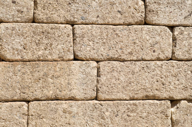 istock Colorful ancient stone wall  closeup  in sunny day 1193741279