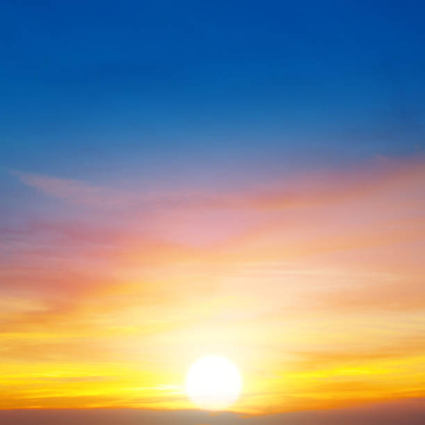 istock Cloudy sky and bright sun rise over the horizon. 1193743528