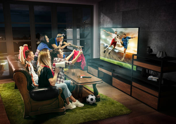 Group of friends watching TV, football match, sport together Group of friends watching TV, football match, sport together. Emotional men and women cheering for favourite team, look on goal and fighting for ball. Concept of friendship, leisure activity, emotions. match sport stock pictures, royalty-free photos & images