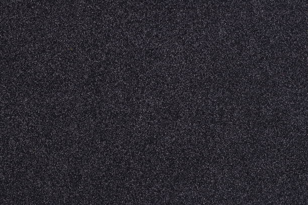 istock Background shiny glow black filled with shiny gold glitter. 1193744408