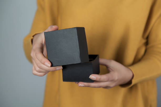 istock woman hand ring with box 1193745012