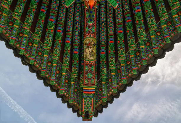 Photo of The roof and blue sky of a Korean Buddhist temple