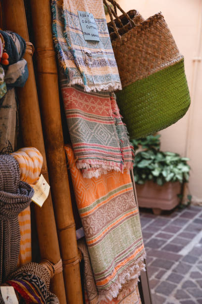 istock Colorful assortment textile fabrics at street. 1193746414