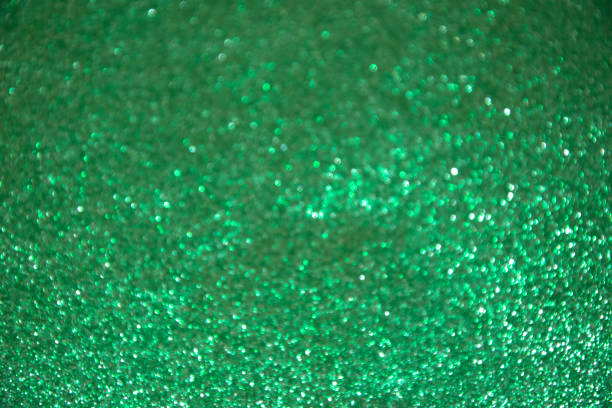 istock Abstract green sparkling glitter background 1193747526