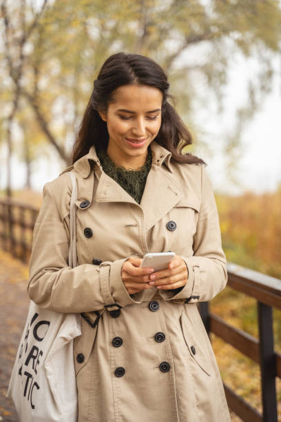 istock Relaxed longhaired brunette girl reading income message 1193748773