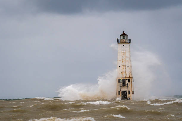 istock Waves crash into the Frankfort North Breakwater Lighthouse 1193748805