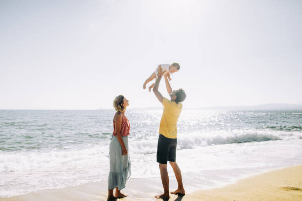istock Young family at the beach 1193748941