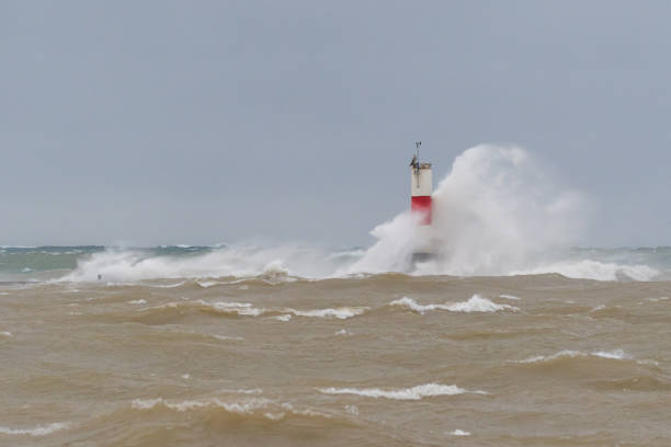 istock Waves crash into the Frankfort South Breakwater Ligh 1193749015