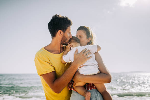 Photo of a young family at the beach