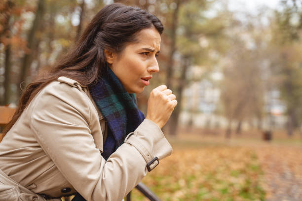 istock Serious longhaired brunette girl suffering strong cough 1193749044