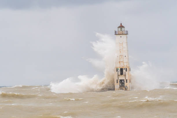 istock Waves crash into the Frankfort North Breakwater Lighthouse 1193749049