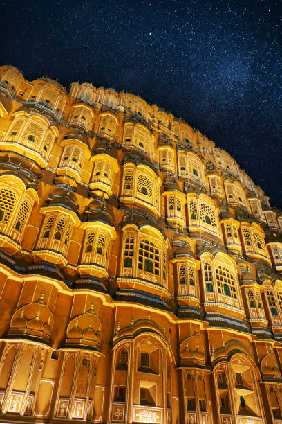 Hawa Mahal or Palace of Winds - medieval palace with 953 windows in Jaipur, India. Hawa Mahal night view with starry sky. Hawa Mahal or Palace of Winds - medieval palace with 953 windows in Jaipur, India. Hawa Mahal night view with starry sky. hawa mahal photos stock pictures, royalty-free photos & images