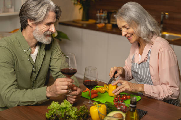 istock Smiling housewife preparing dinner for her husband 1193752473