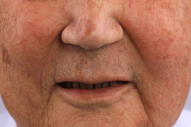 istock old man's mouth macro closeup 1193753022