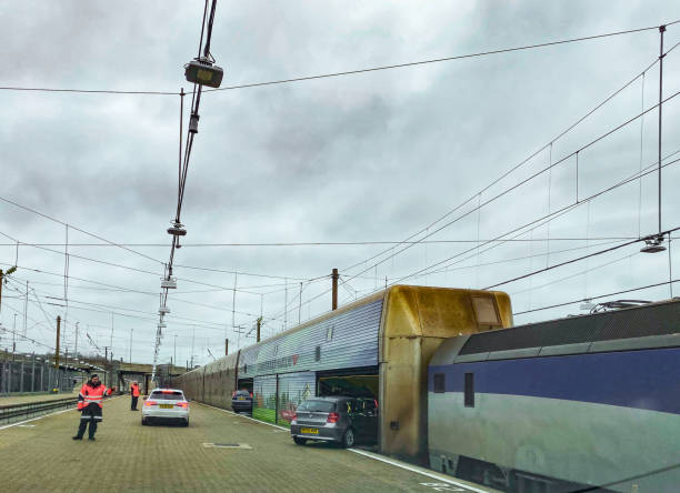 Maastricht, The Netherlands - September 18, 2014: Tracks and trains at station Maastricht Centrale, view from pedestrian bridge crossing tracks.