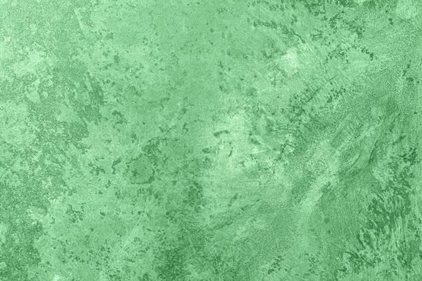 istock mint colored low contrast Concrete textured background with roughness and irregularities 1193754796