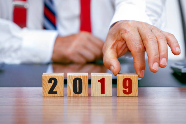 istock Businessman with wooden blocks, 2019. 1193754871