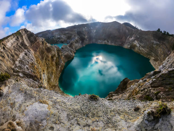 istock Kelimutu - Turquoise colored volcanic lake 1193754951