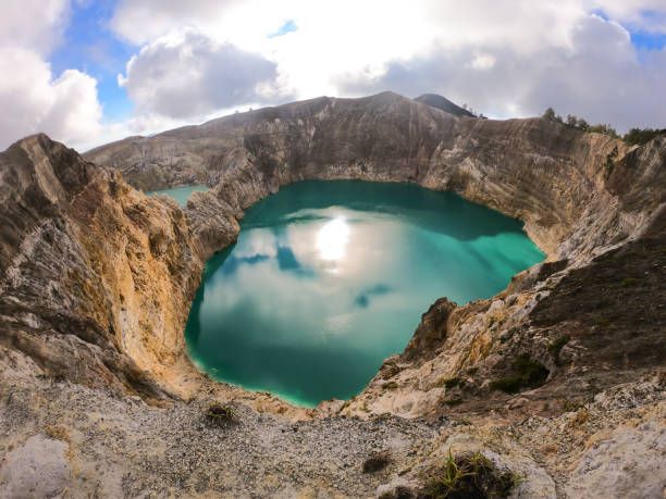 istock Kelimutu - Turquoise colored volcanic lake 1193754992