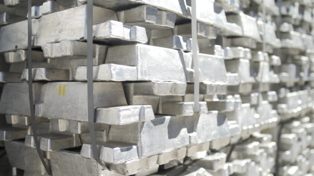 Metal ingots in Stock Warehouse. Billets for aluminium profile production at a metallurgical plant