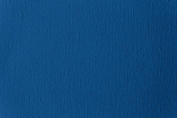 blue classic primed artist's canvas fabric sfondo colore trendy dell'anno 2020 close-up texture grid pattern macro photography - primed foto e immagini stock