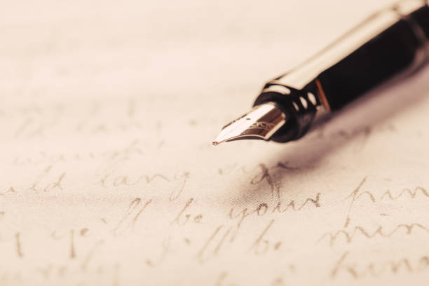 istock fountain pen on paper with ink text closeup 1193757371