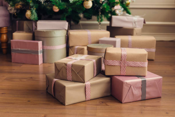 istock Christmas and New Year decorations with lights.Christmas tree and gift boxes left by santa claus 1193757482