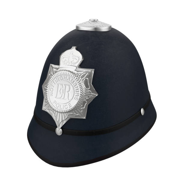 英国警察ボビーヘルメット帽子孤立 - police helmet ストックフォトと画像