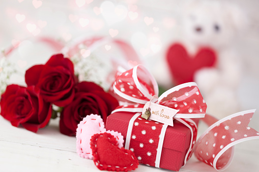 Valentine's Day Gift with Red Roses against a White Background