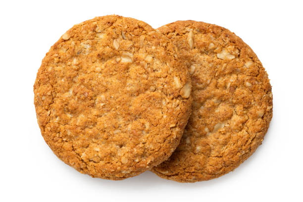 istock Two crunchy oat and wholemeal biscuits isolated on white. Top view. 1193759378