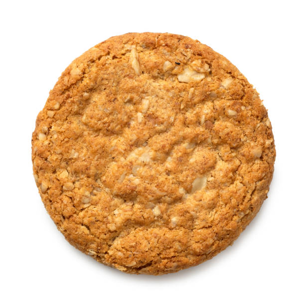 Crunchy oat and wholemeal biscuit isolated on white. Top view.