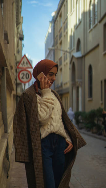 istock Young woman talking whit smartphone 1193762179