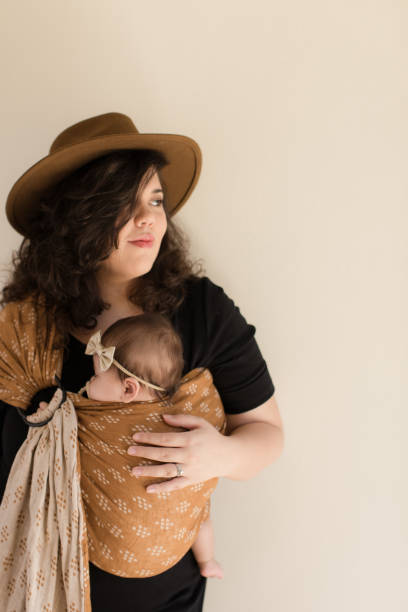 istock Mother Wearing Her Baby 1193764640