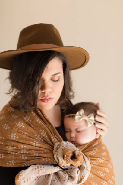 istock Mother Wearing Her Baby 1193764658