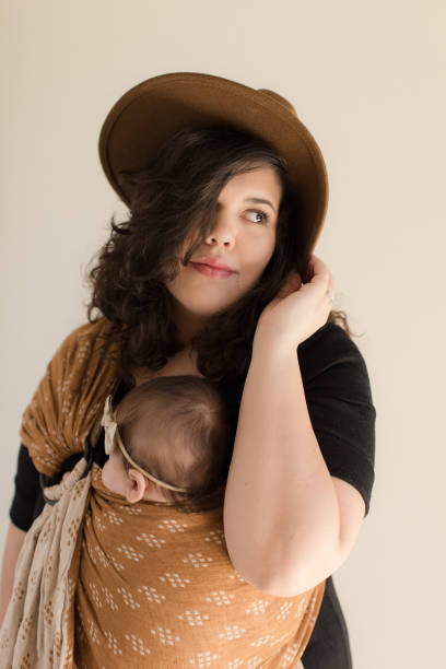 istock Mother Wearing Her Baby 1193764670