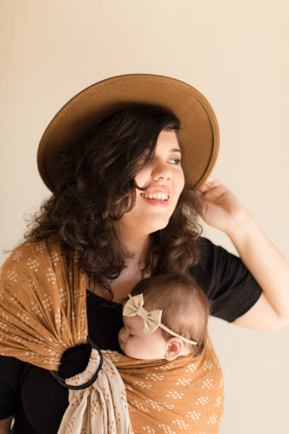 istock Mother Wearing Her Baby 1193764762