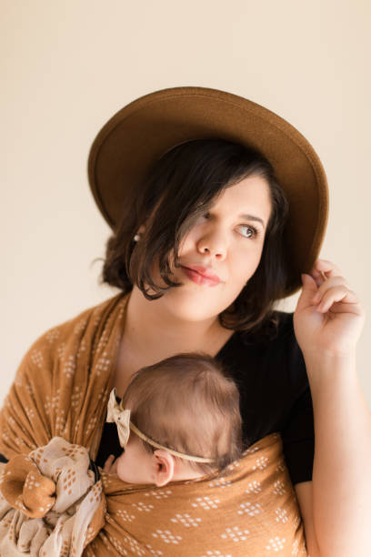 istock Mother Wearing Her Baby 1193764838