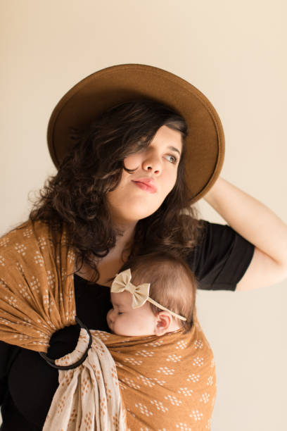 istock Mother Wearing Her Baby 1193764878