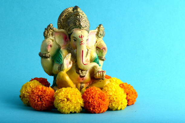 istock Hindu God Ganesha. Ganesha Idol on Blue Background 1193765520