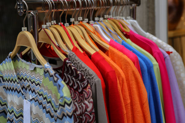 istock Clothes hanging on a counter in a store 1193765620
