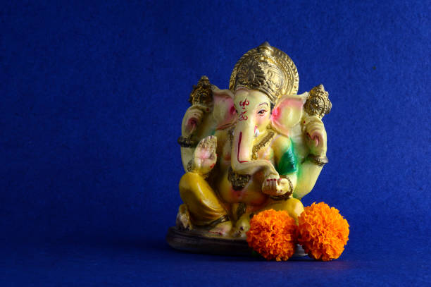 istock Hindu God Ganesha. Ganesha Idol on Blue Background 1193766021