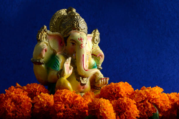 istock Hindu God Ganesha. Ganesha Idol on Blue Background 1193768143