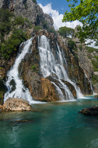 istock waterfall flowing from the rocks 1193770386
