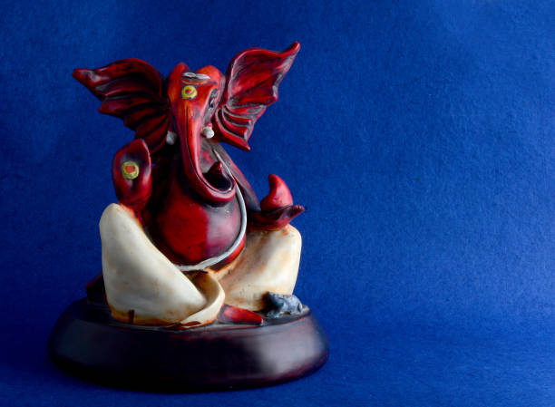 istock Hindu God Ganesha. Ganesha Idol on Blue Background 1193771018
