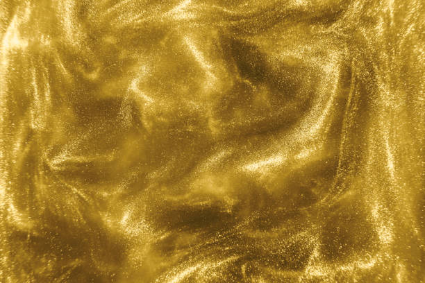 istock gold glitter shimmering magic bokeh background 1193771508